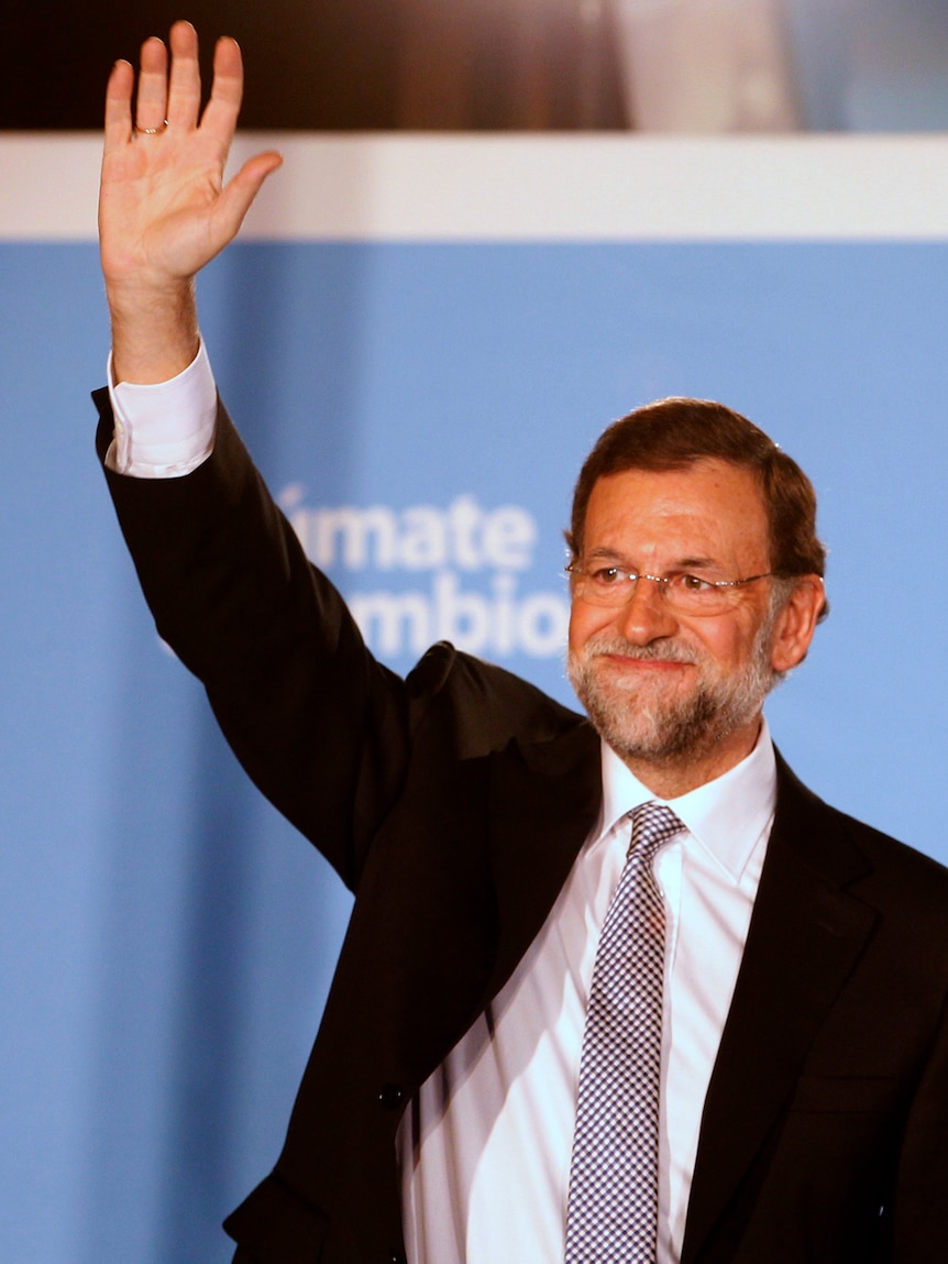 Mariano Rajoy has outlined a freeze on public wages and tax hikes for Spain's wealthiest.