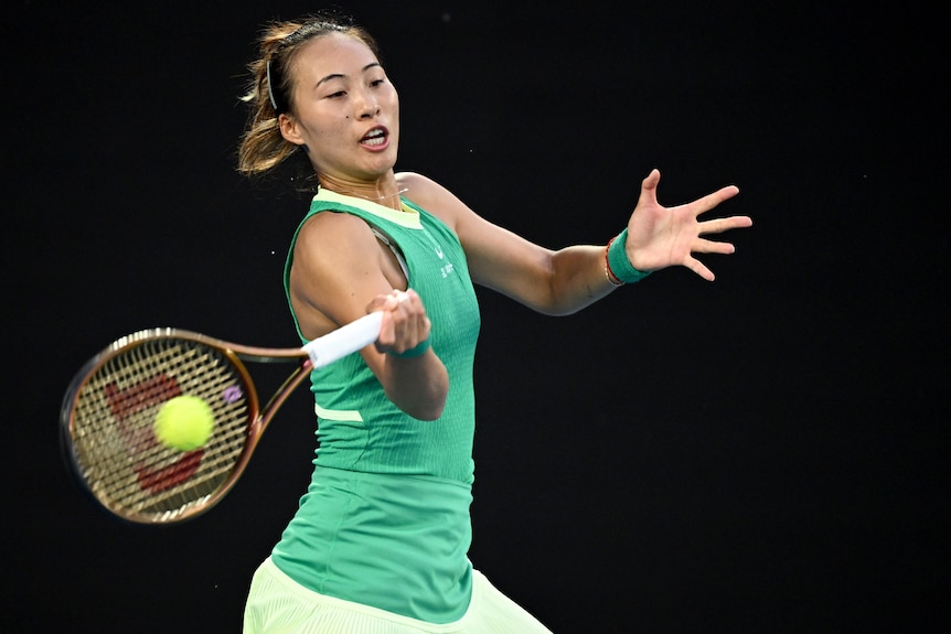 Zheng Qinwen plays a forehand at the 2024 Australian Open.