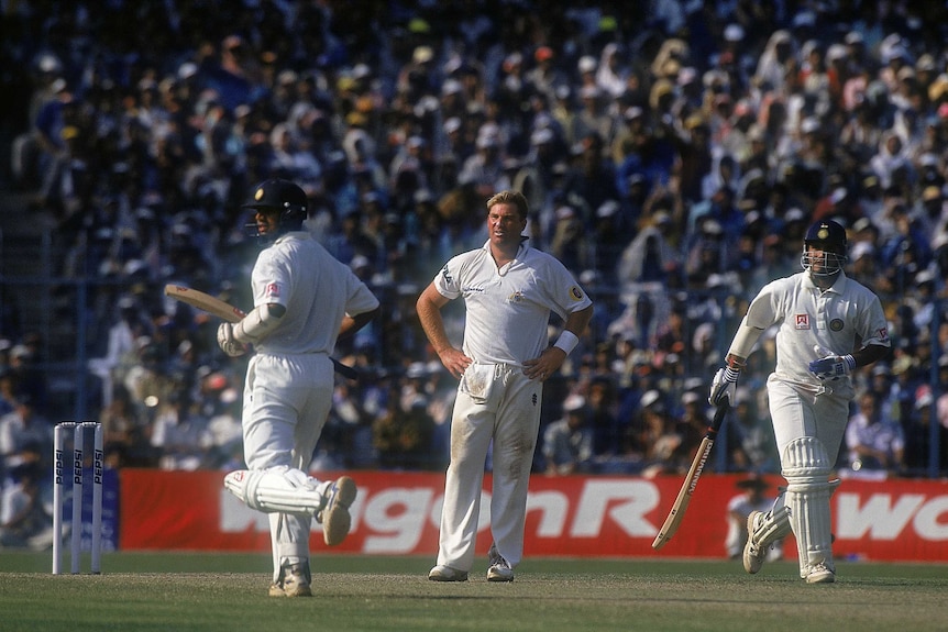 Shane Warne looks on as VVS Laxman and Rahul Dravid rack up the runs in Kolkata, 2001