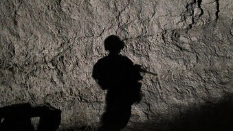 The shadow of a US Marine in Afghanistan.