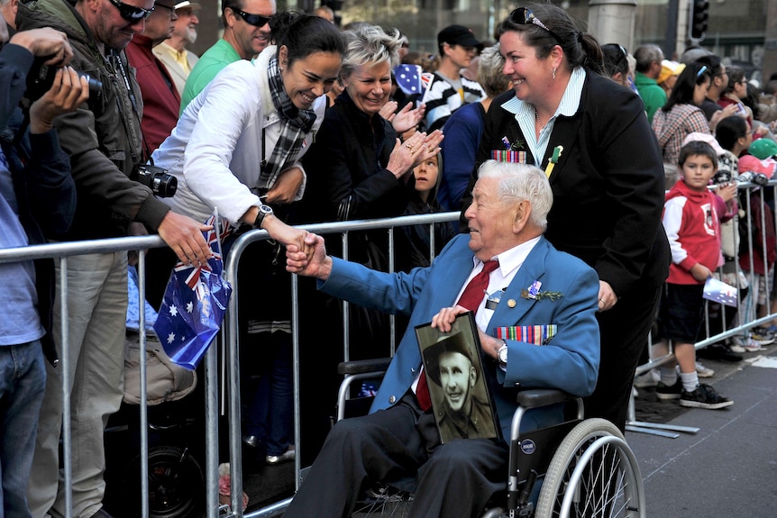 A woman thanks a digger in Sydney.