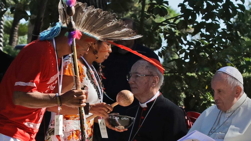 Members of indigenous populations perform a tree-planting rite for Pope Francis on the occasion of the feast of St Francis of Assisi, the patron saint of ecology, in the Vatican gardens