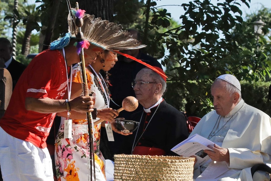 Members of indigenous population in the Amazon with Pope Francis.