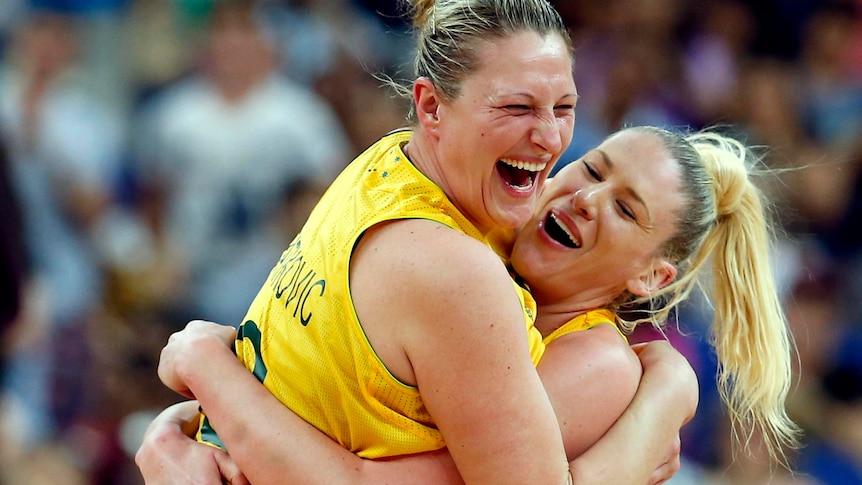 Lauren Jackson (R) and Suzy Batkovic celebrate victory after their bronze medal basketball match.