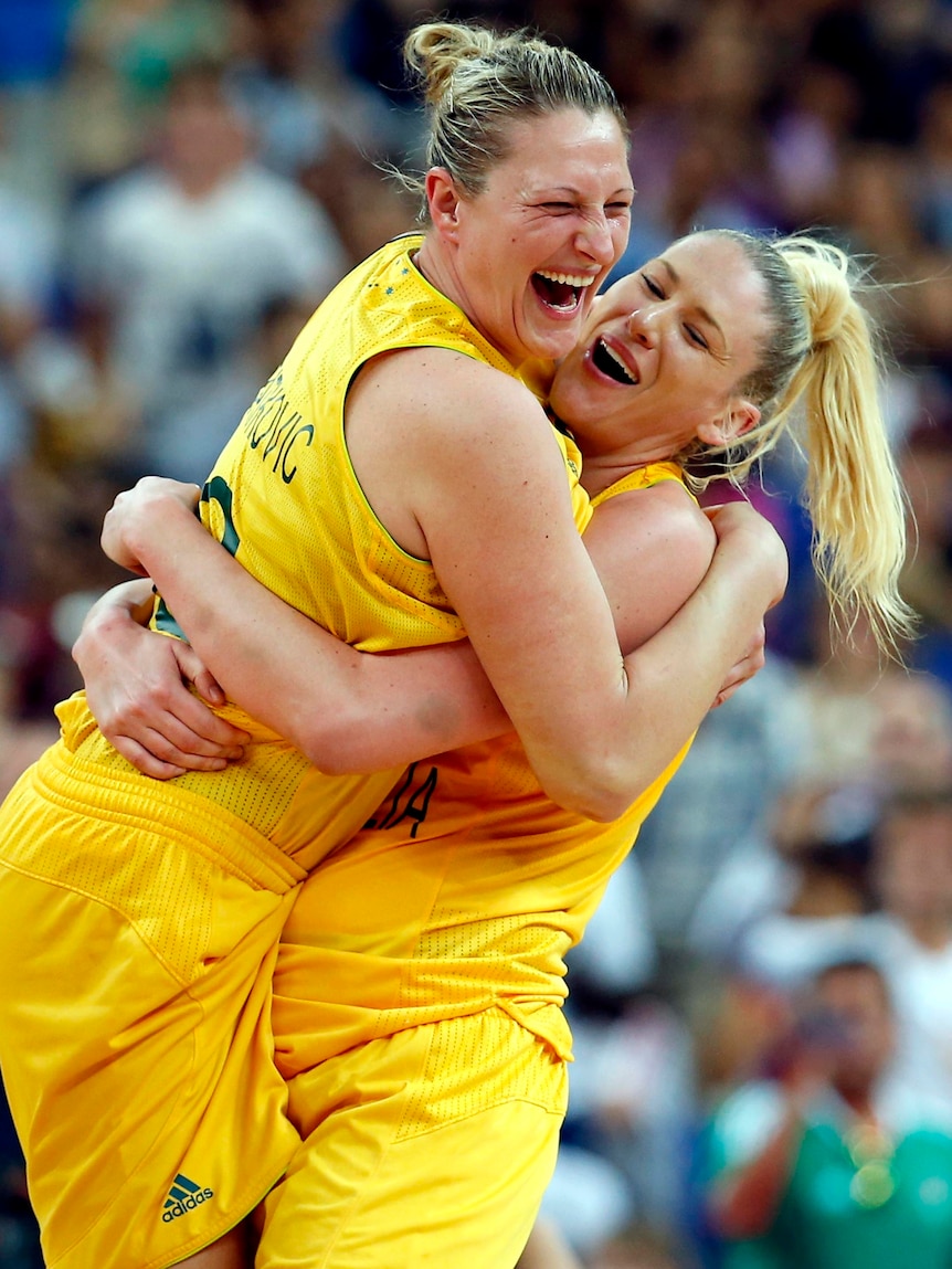 Lauren Jackson (R) and Suzy Batkovic celebrate victory after their bronze medal basketball match.