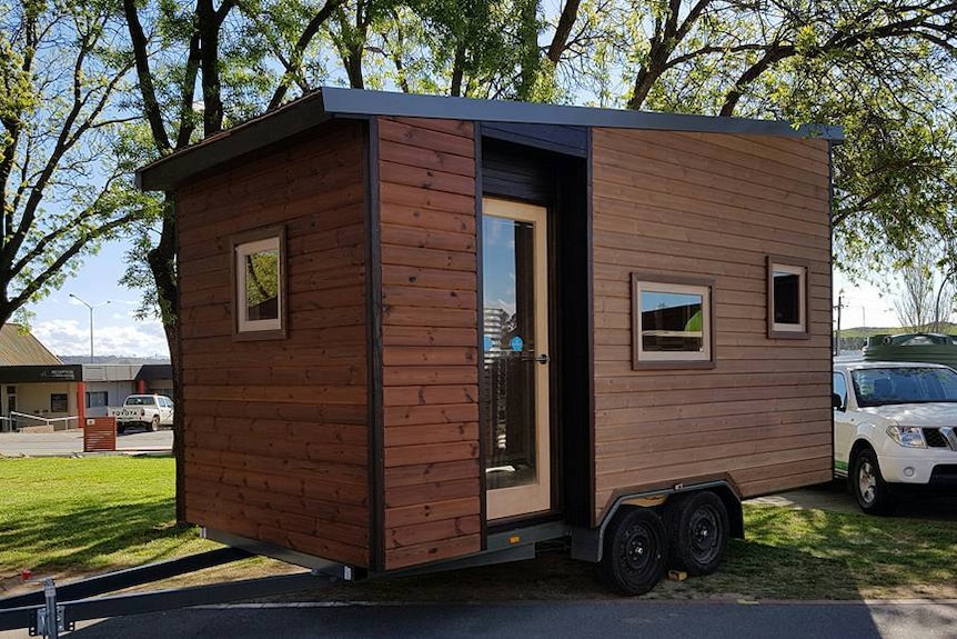 A small house-like structure on wheels.