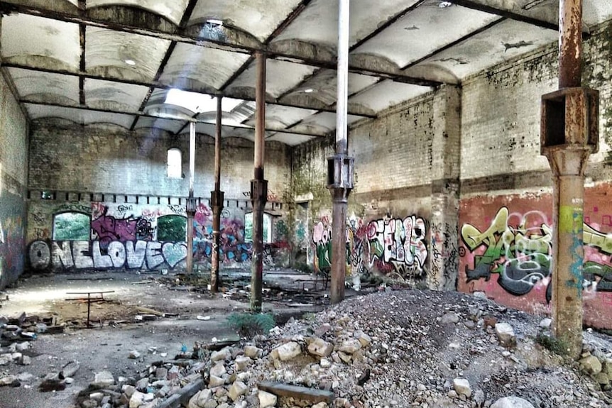A warehouse with graffitti