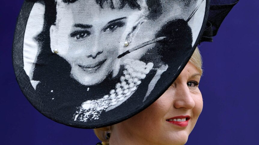 Carolyn Heaney shows off her hat before the running of the Melbourne Cup.