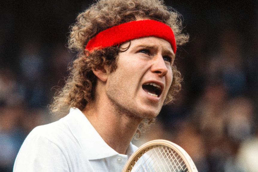 John McEnroe looks frustrated during a match