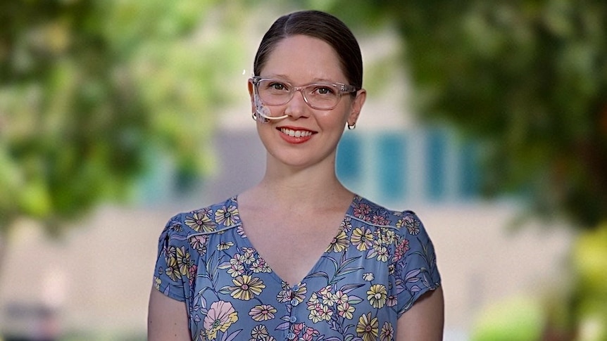 Tanya Kretschmann smiles as she stands outside.