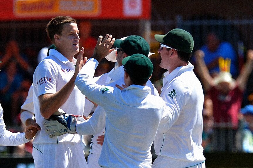South Africa's Morne Morkel (L) celebrates after dismissing Australia's Nathan Lyon.