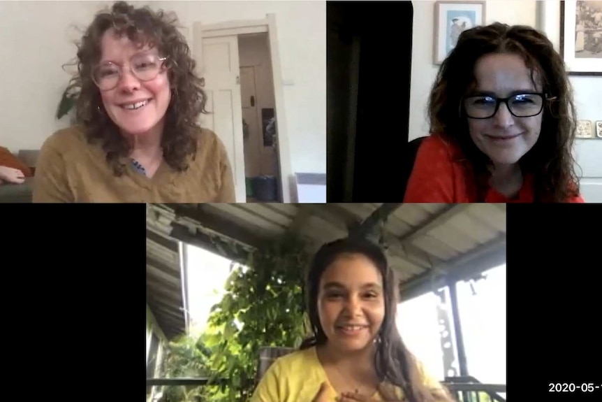 Three women on computer screen.