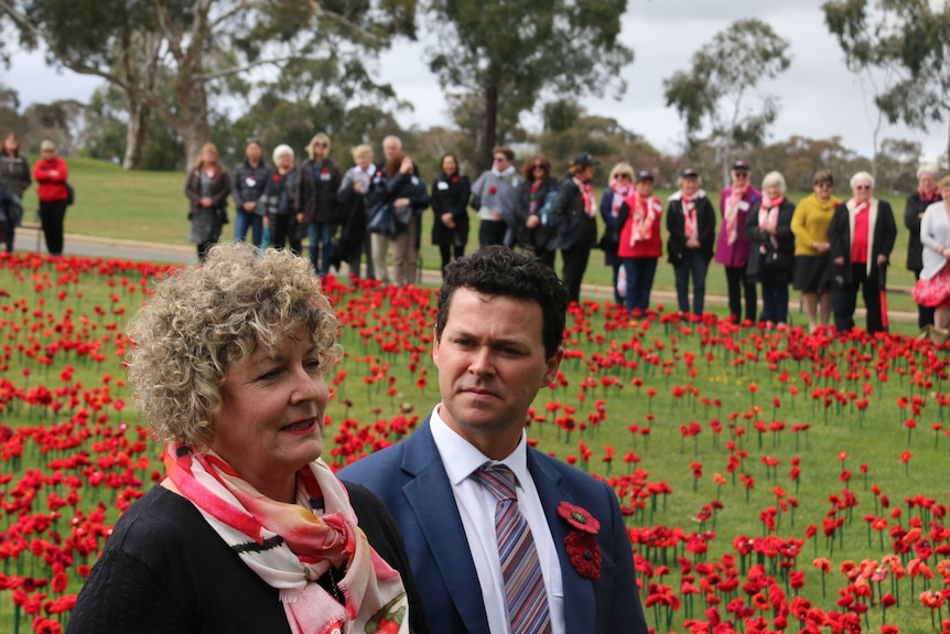 Lynn Berry and Phillip Johnson speak in front of the Australian War Memorial