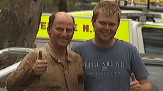Two of the rescued men give the thumbs-up after being pulled out of the cave.