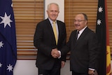 Malcolm Turnbull (left) shakes hands with Peter O'Neill