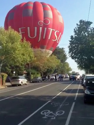 The balloon had 10 people on board and had to be guided down between power lines.