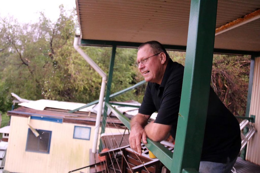 Roger Gellett surveys the damage left by Cyclone Nathan