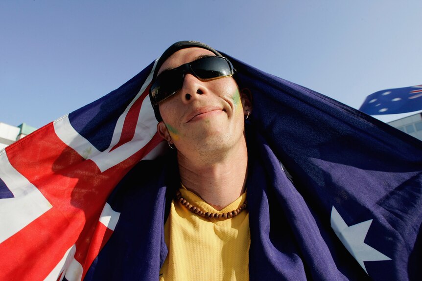 A proud Australian draped in the national flag (Getty Images: Ralph Orlowski)