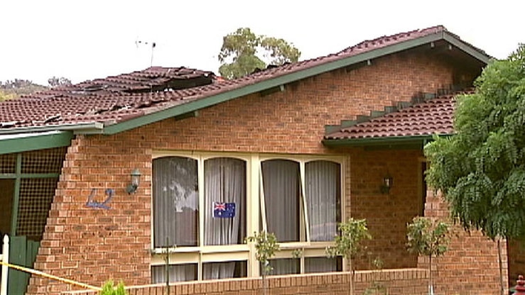 Police suspect the fire in the ceiling of this Macarthur house in Canberra may have been caused by incorrectly installed insulation.