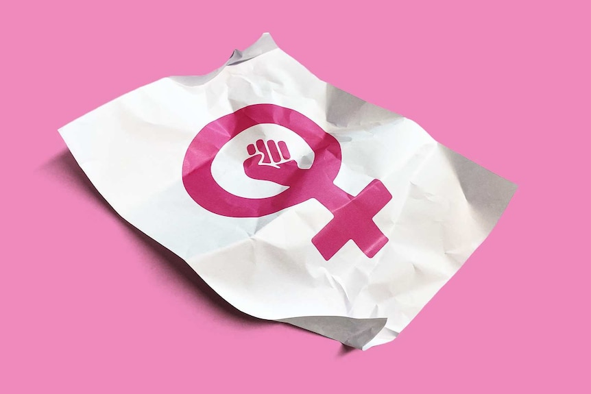 Crumpled piece of paper with the feminist symbol of a pink female glyph with a fist to depict family not agreeing with feminism.