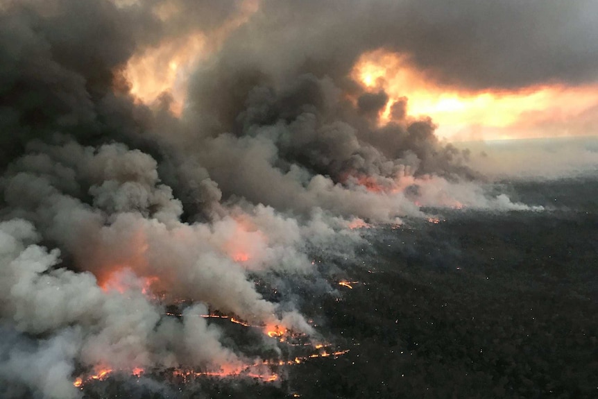 A huge smoky wildfire as seen from the air.