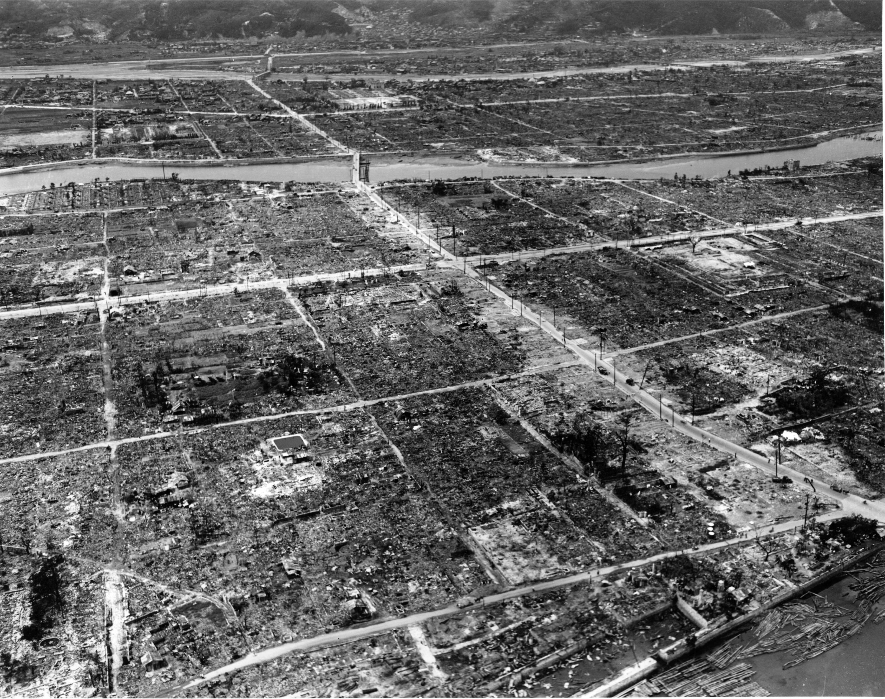 An aerial view of large square patches of charred land and empty dirt roadways