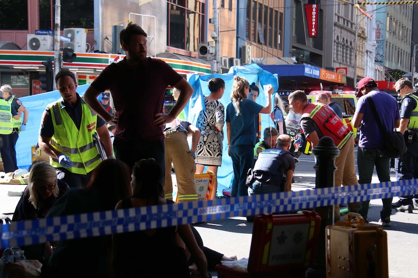 Medical crews held up privacy screens as they treated people who were hit by a speeding car in central Melbourne.