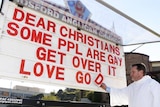 A church sign reads "Dear Christians, some people are gay, get over it. Love God."