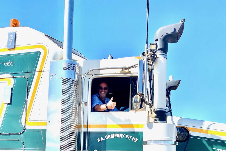 man in a truck gives a thumbs up