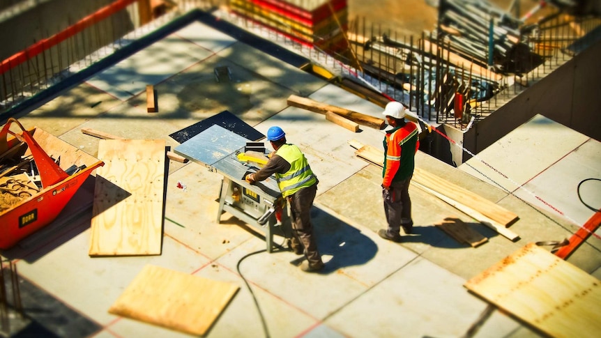 A high shot showing two men working on a construction site.