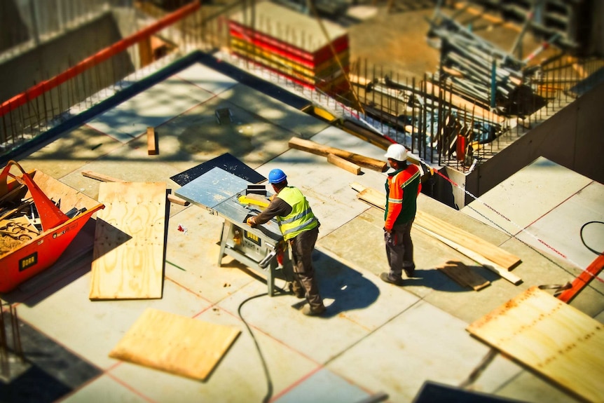 A high shot showing two men working on a construction site.