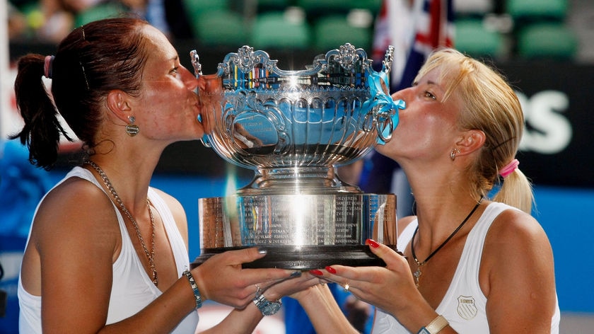 Ukrainian sisters Kateryna and Alona Bondarenko celebrate winning the women's doubles title