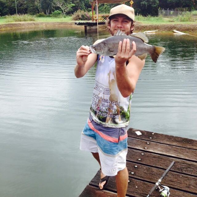 a man holding a fish