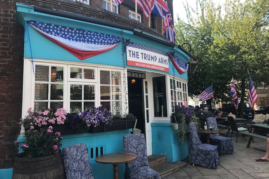 External view of a pub with American and British flags and a sign saying "The Trump Arms"