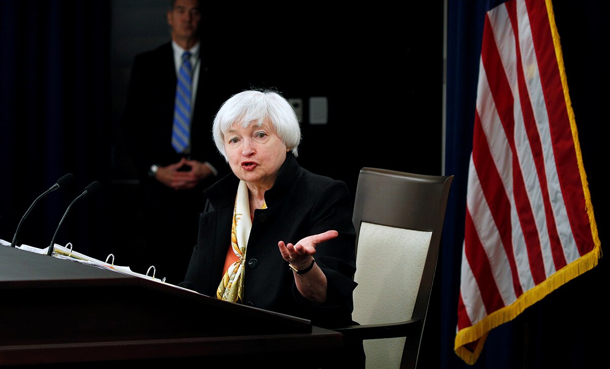 Janet Yellen gestures as she talks during a news conference.