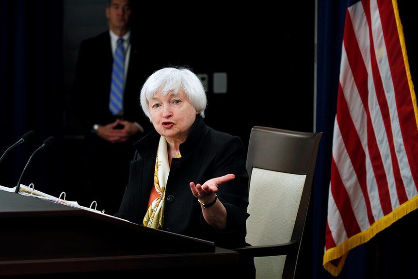 Janet Yellen gestures as she talks during a news conference.