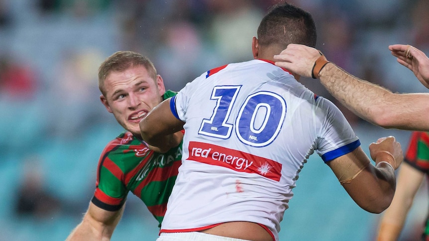 Two NRL players square up to each other during a match.