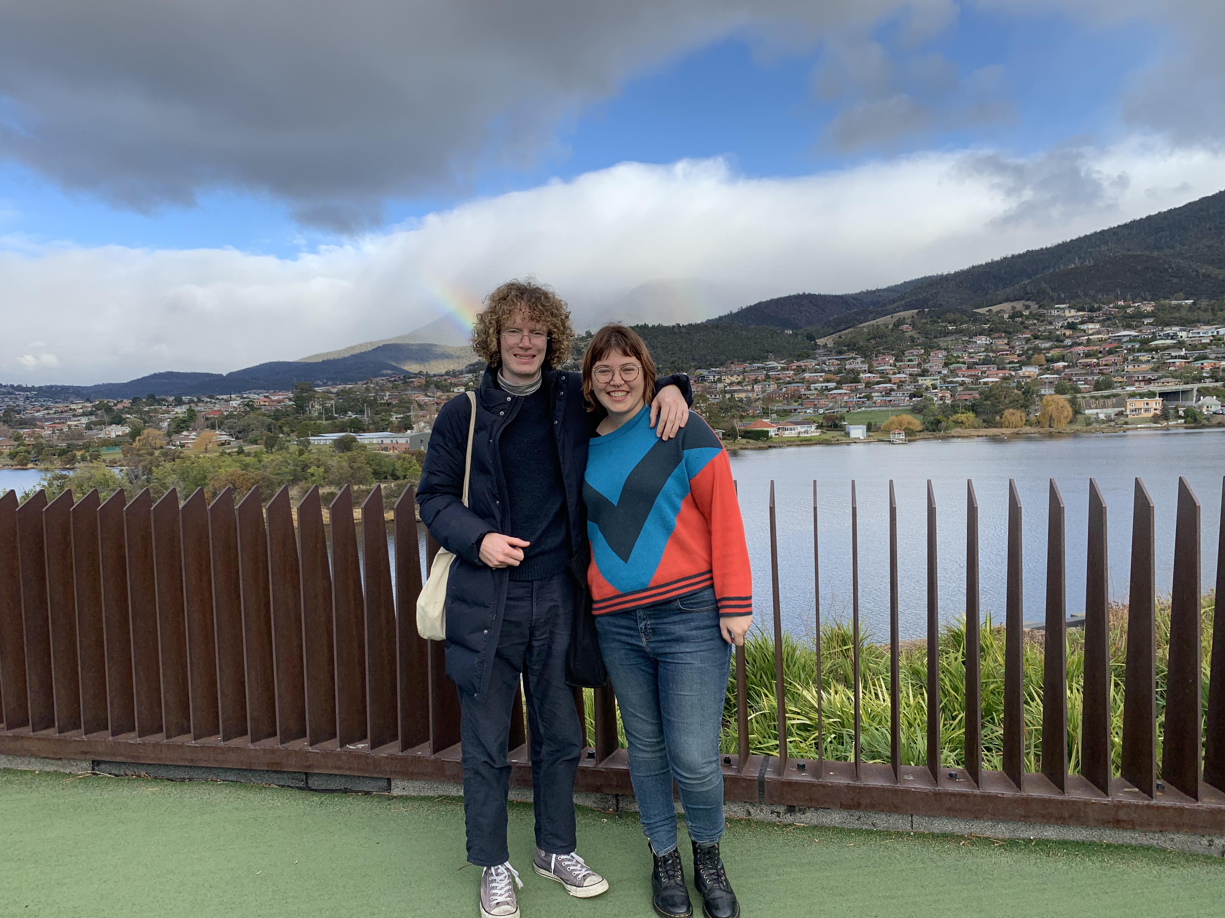 Sian Campbell and husband Murray stand in front of a beautiful vista in Tasmania.