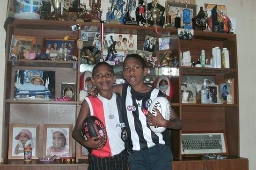 Blake and Keidean Coleman supporting their favourite AFL teams as young boys