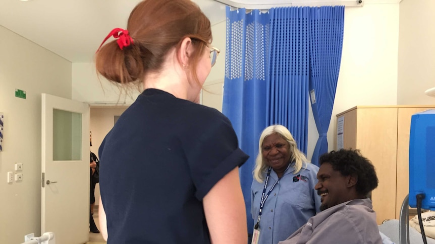 Interpreter Martina Badal helps a patient at Broome Hospital as part of a new trial in the Kimberley.