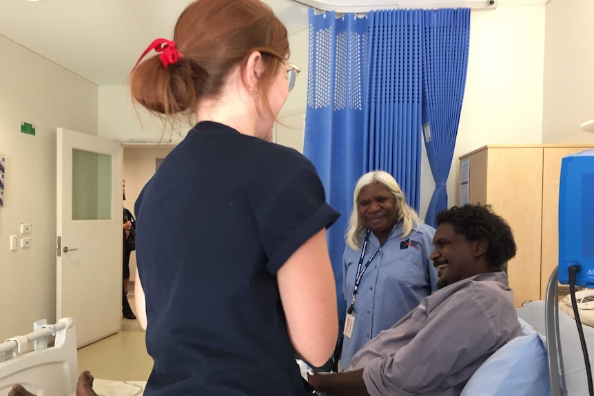 Interpreter Martina Badal helps a patient at Broome Hospital as part of a new trial in the Kimberley.