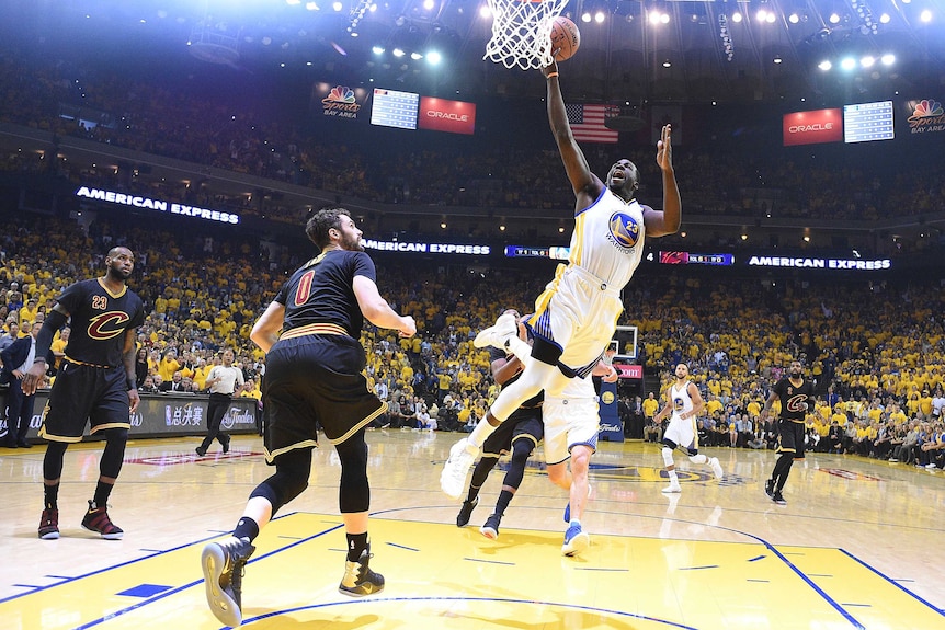 Golden State Warriors' Draymond Green goes up for a dunk against Cleveland Cavaliers in the NBA Finals