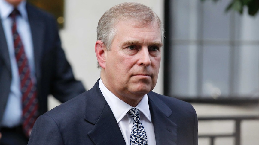 A head-and-shoulders picture of Prince Andrew wearing a suit and tie.