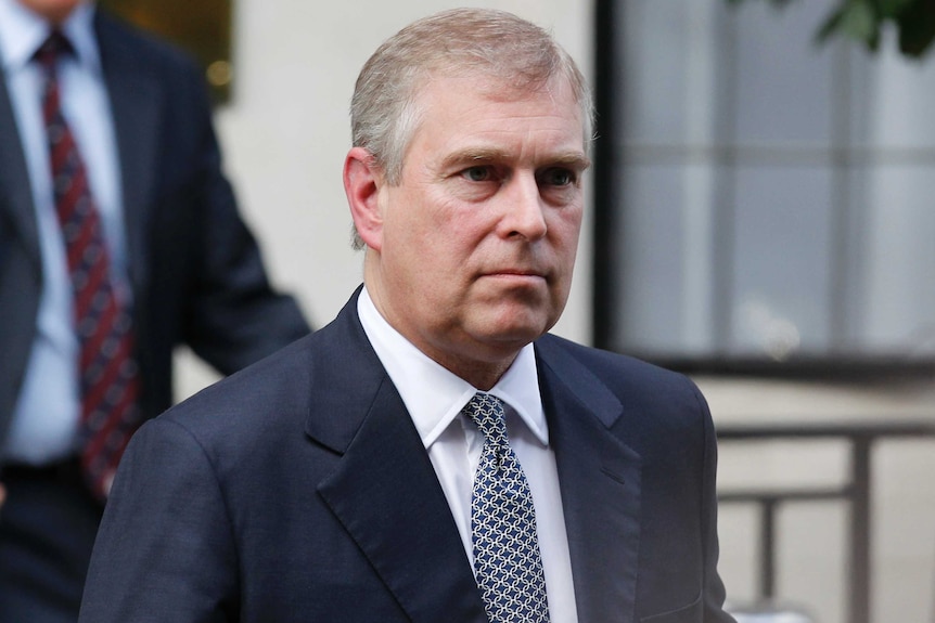 A head-and-shoulders picture of Prince Andrew wearing a suit and tie.