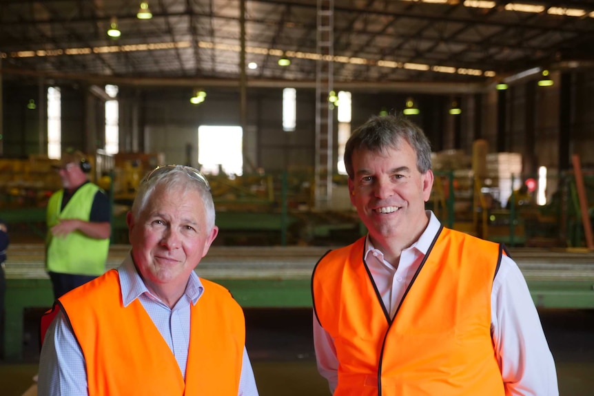 Parkside Group director, Robert Tapiolas and WA Forestry Minister Dave Kelly at Greenbushes timber mill.