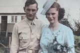 Sepia coloured photo of army man and bride is pastel blue