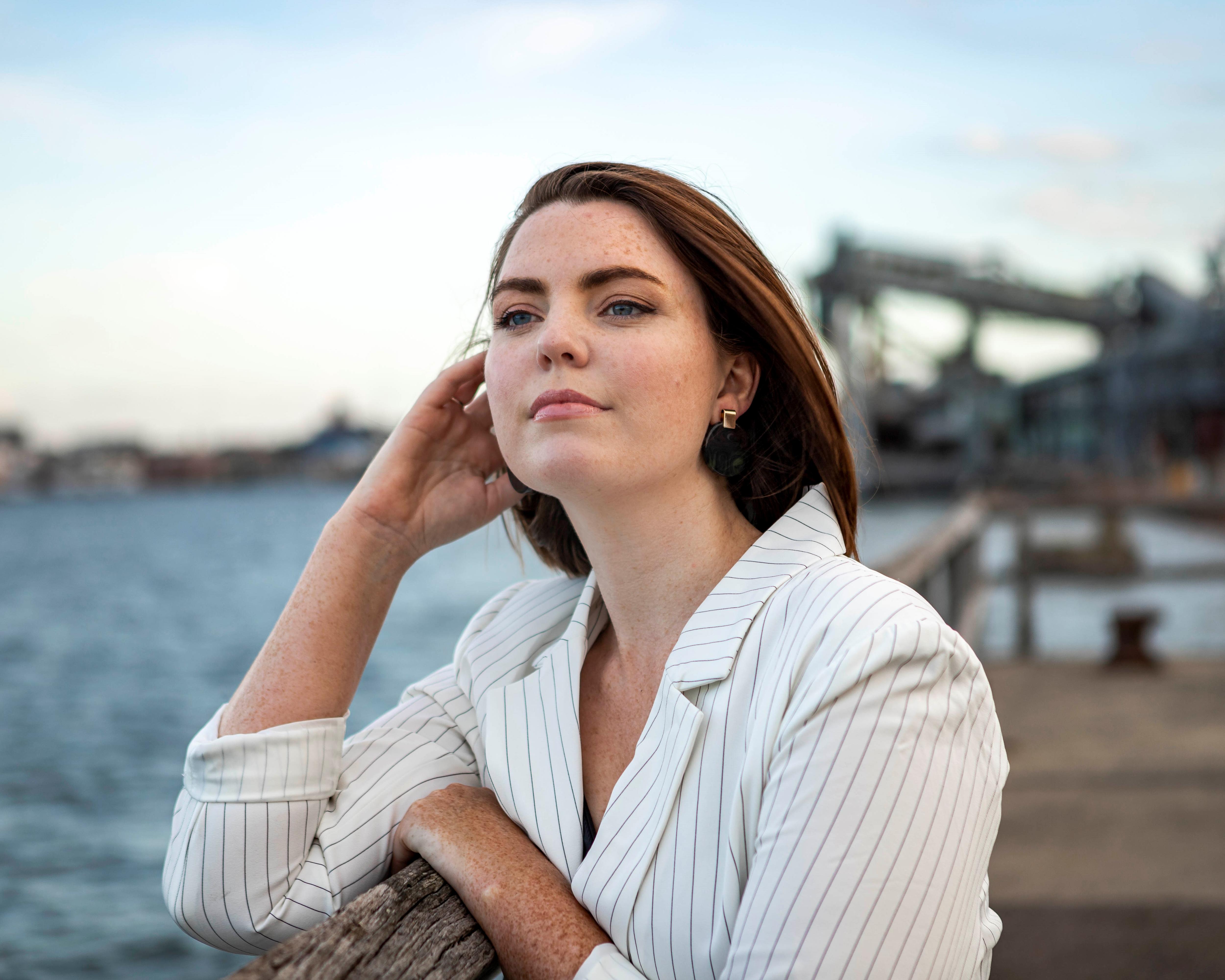 Amy Thunig looks out over a body of water.