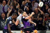 Billy Slater discards the ball as he rejoices