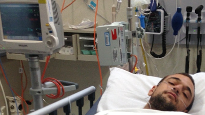 Young man in hospital bed