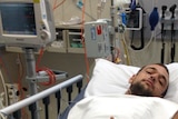 Young man in hospital bed